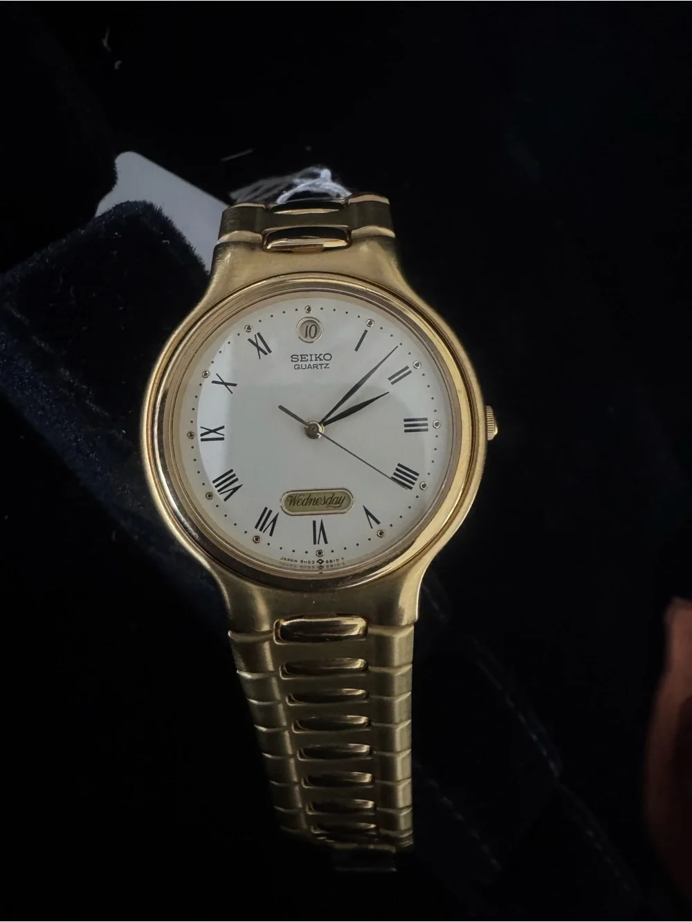 Seiko Gold Tone Watch with White Dial and Roman Numerals